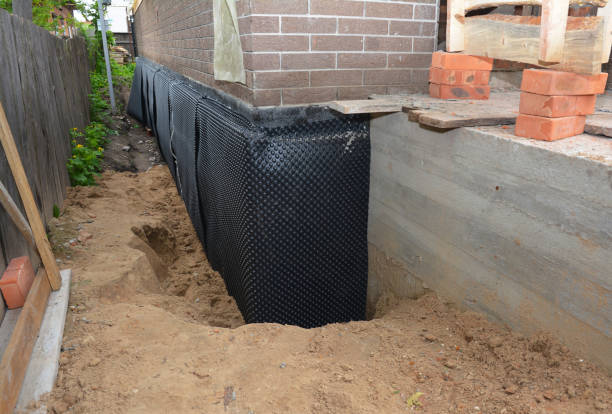 SJ Waterproofing Pros technician performing targeted Emergency Waterproofing assessment in West Liberty, OH
